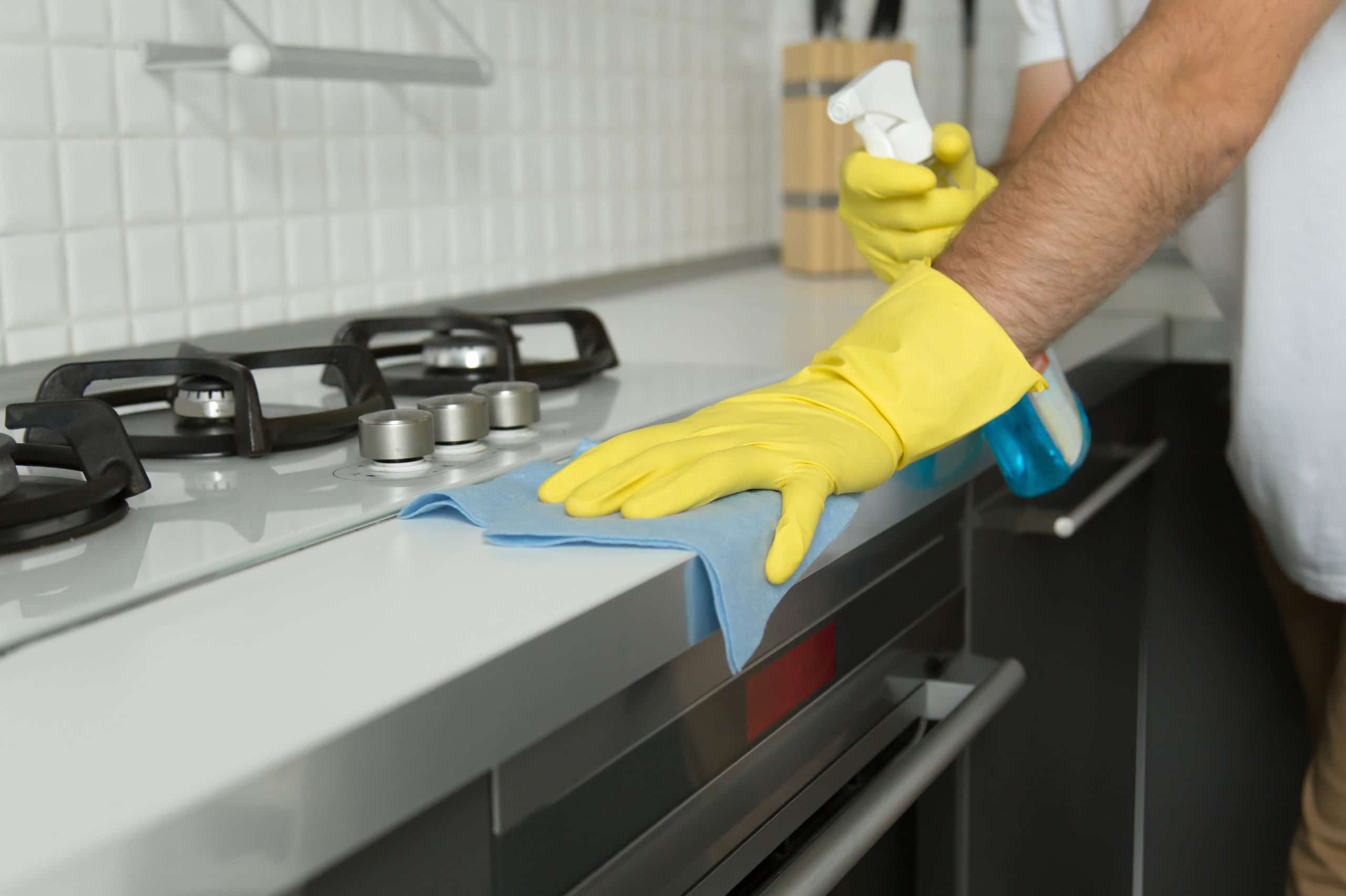 closeup-of-male-hands-in-rubber-gloves-cleaning-th-PA25GCU-scaled-1.jpg